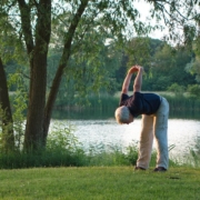 Senior man exercising next to a lake