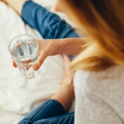 Woman holding a glass of water