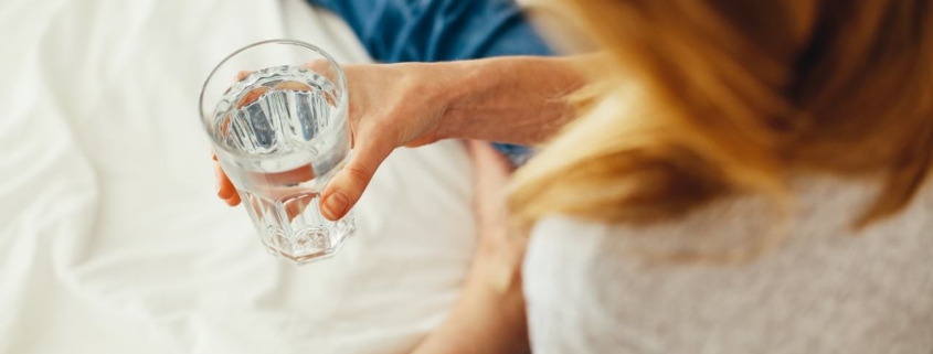 Woman holding a glass of water